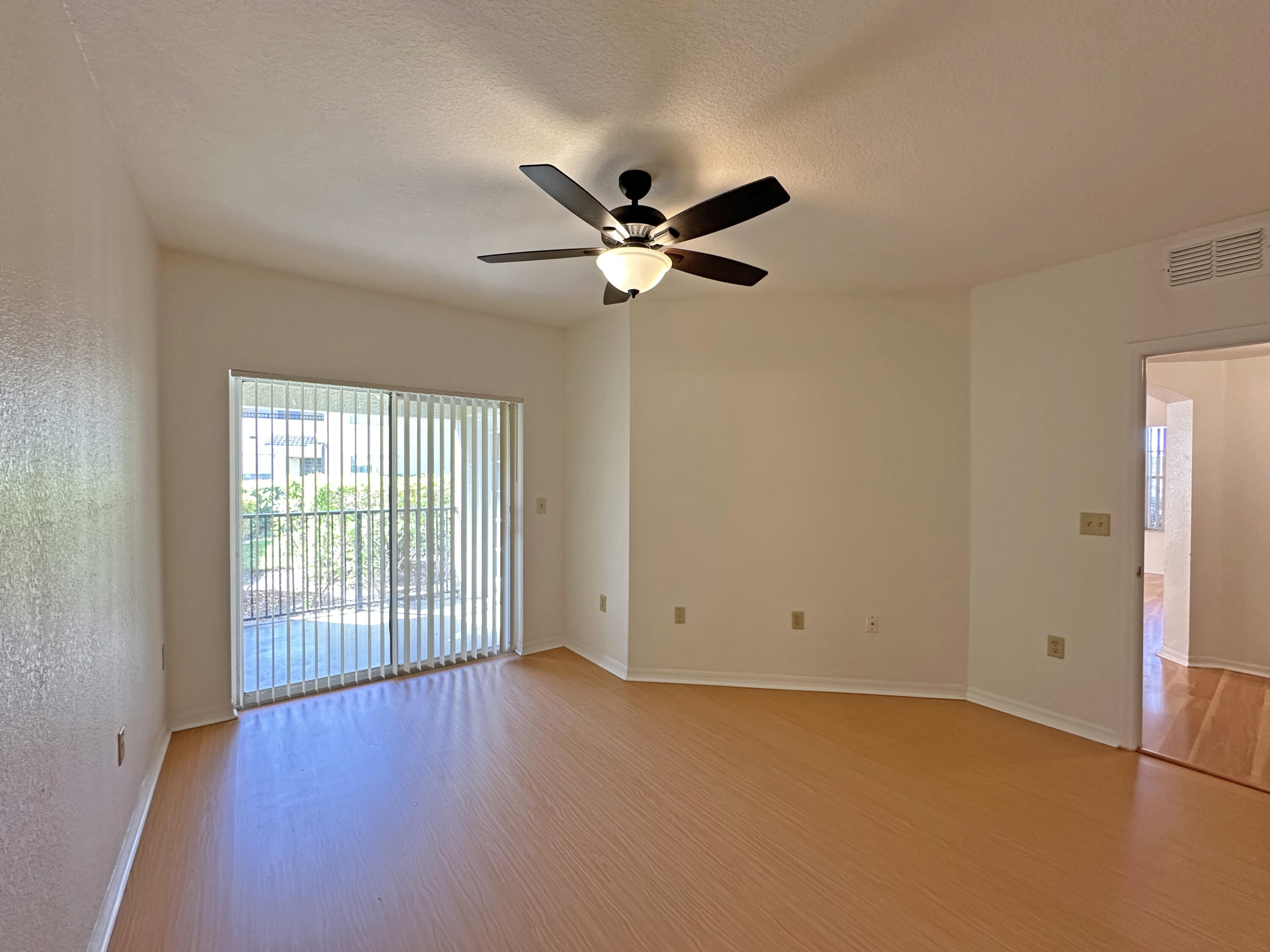 166 Southwest Peacock Boulevard, Unit 104 Port St. Lucie, FL 34986 - Photo 13 of 45 a view of an empty room with a window