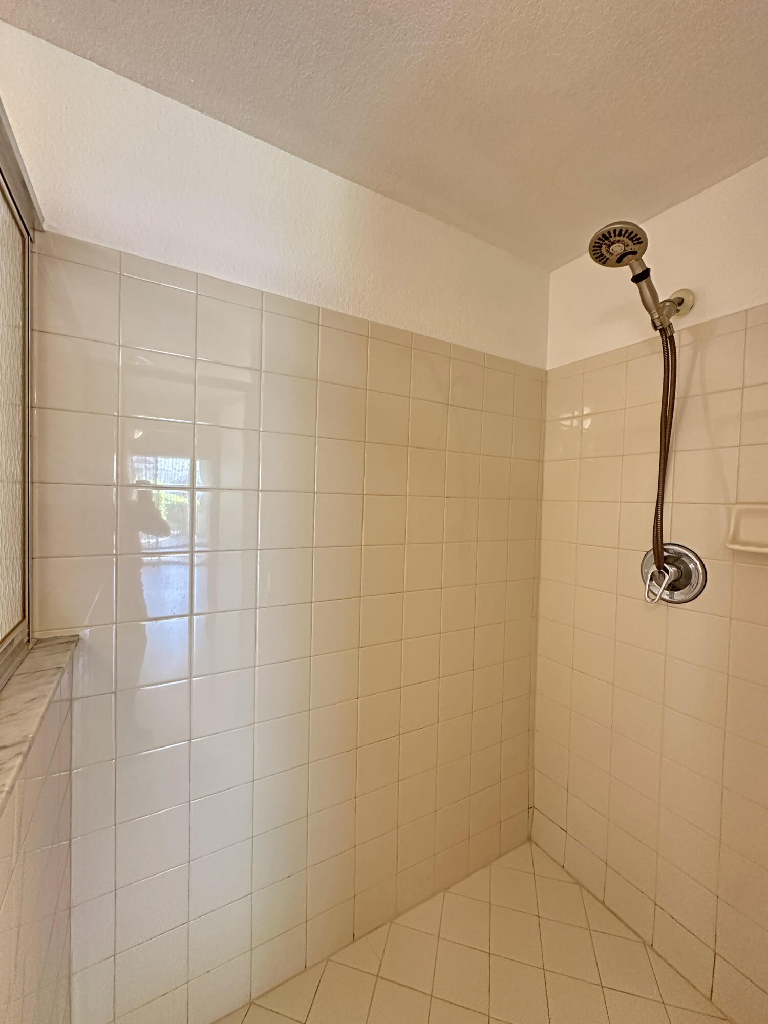 166 Southwest Peacock Boulevard, Unit 104 Port St. Lucie, FL 34986 - Photo 17 of 45 a bathroom with a shower