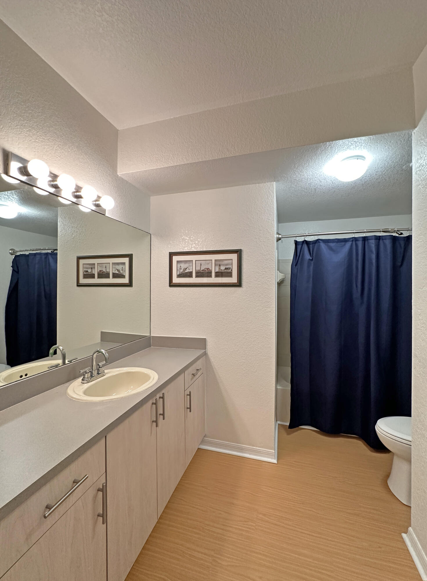 166 Southwest Peacock Boulevard, Unit 104 Port St. Lucie, FL 34986 - Photo 21 of 45 a bathroom with a sink and a mirror