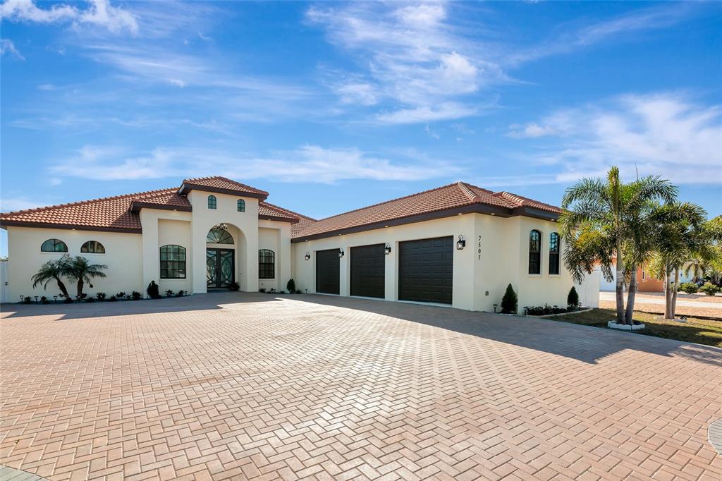 7505 27th Avenue West Bradenton, FL 34209 - Photo 1 of 66 a view of a white house with a yard