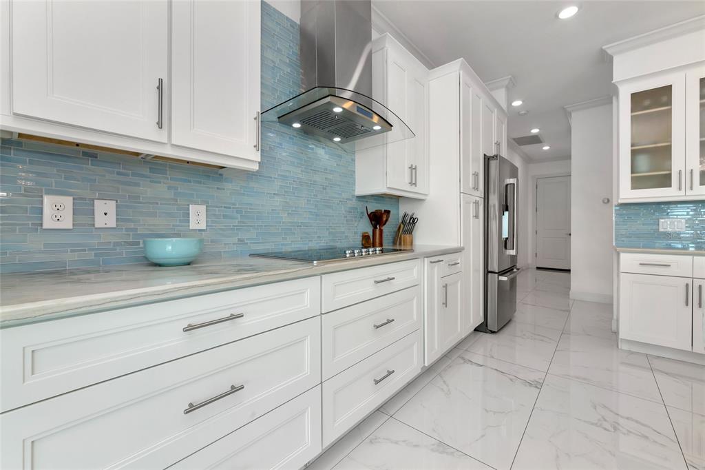 7505 27th Avenue West Bradenton, FL 34209 - Photo 12 of 66 a kitchen with white cabinets and a sink