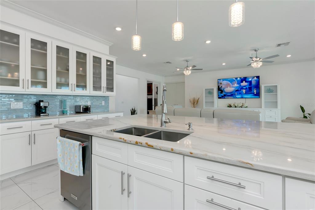 7505 27th Avenue West Bradenton, FL 34209 - Photo 14 of 66 a kitchen with stainless steel appliances granite countertop a sink stove and cabinets