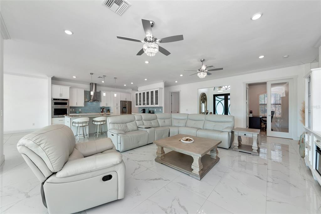 7505 27th Avenue West Bradenton, FL 34209 - Photo 17 of 66 a living room with furniture and kitchen view