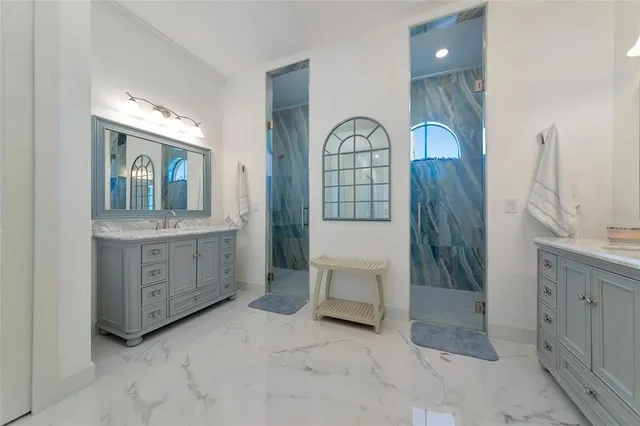 a bathroom with a granite countertop toilet sink and a mirror
