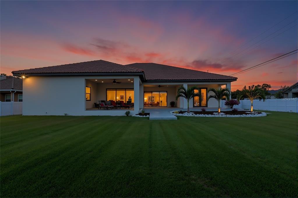 7505 27th Avenue West Bradenton, FL 34209 - Photo 3 of 66 a front view of house with yard and outdoor seating
