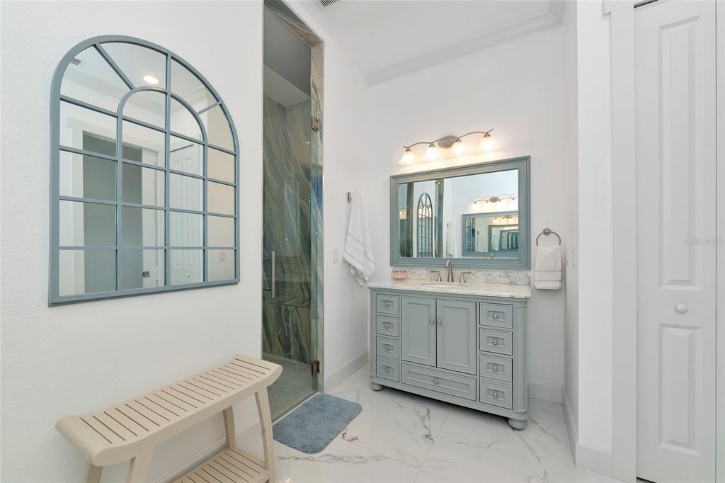 7505 27th Avenue West Bradenton, FL 34209 - Photo 31 of 66 a bathroom with a granite countertop sink and a mirror