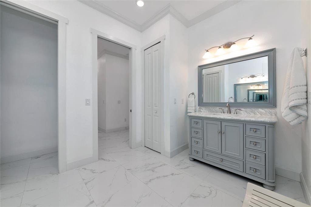 7505 27th Avenue West Bradenton, FL 34209 - Photo 32 of 66 a bathroom with a sink vanity and mirror