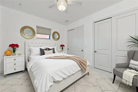 a view of a room with furniture and a chandelier