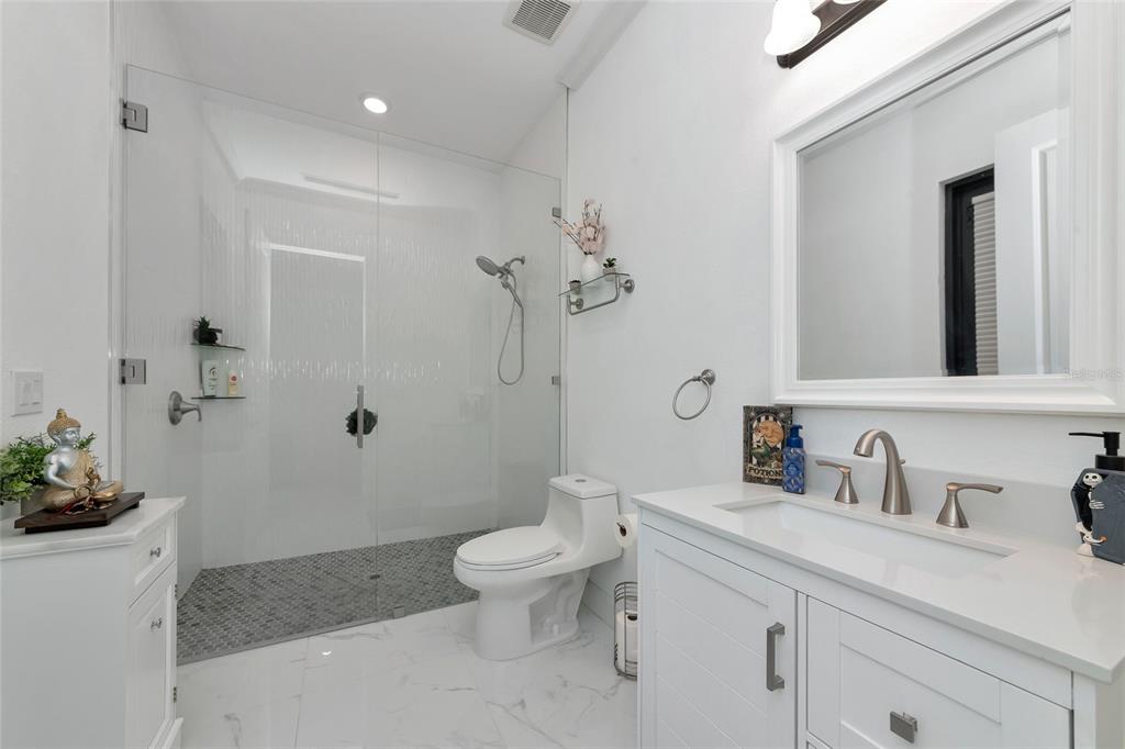 7505 27th Avenue West Bradenton, FL 34209 - Photo 36 of 66 a bathroom with a sink a toilet and shower