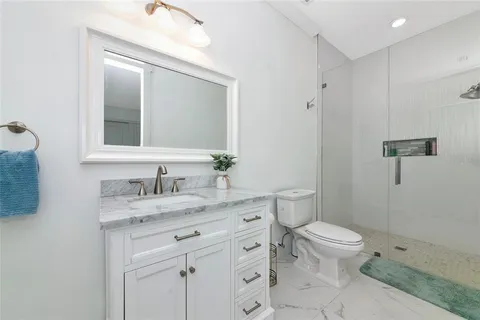 a dining room with furniture a rug and a chandelier