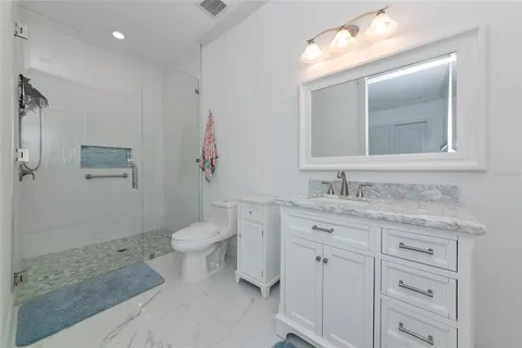 a view of a house with swimming pool and sitting area