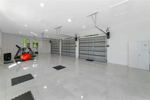 a view of a swimming pool with an outdoor seating a yard and ocean view