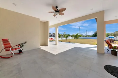 a view of a swimming pool with lounge chairs