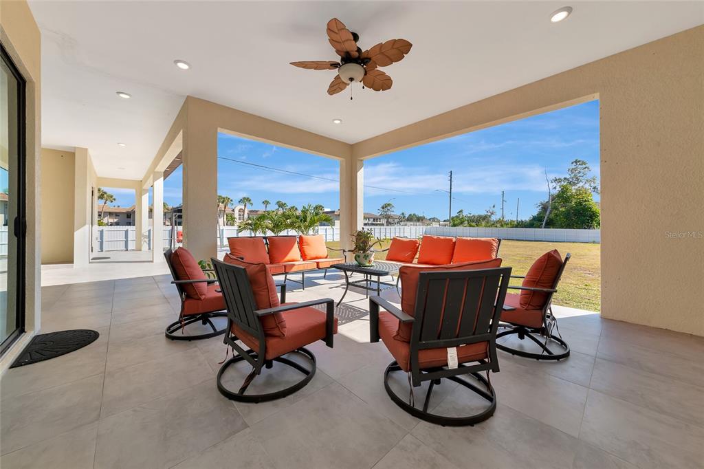 7505 27th Avenue West Bradenton, FL 34209 - Photo 48 of 66 a dining room with furniture a rug and a chandelier