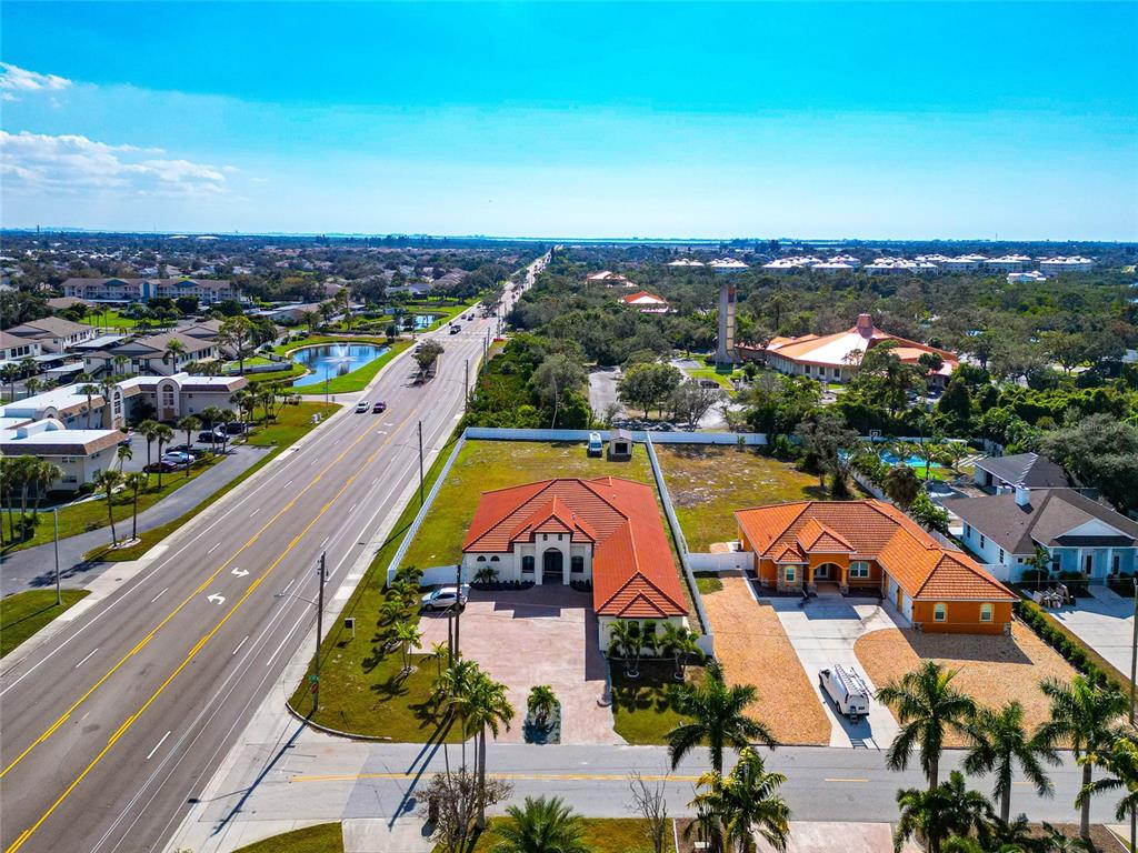 7505 27th Avenue West Bradenton, FL 34209 - Photo 61 of 66 an aerial view of residential houses with outdoor space and swimming pool
