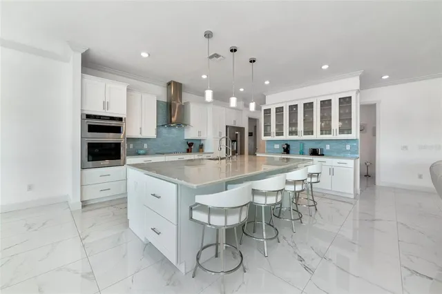 a kitchen with white cabinets and a sink