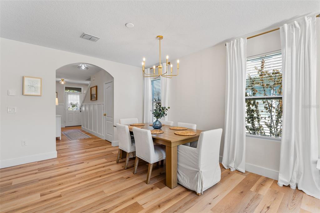 113 Camilla Road DeLand, FL 32724 - Photo 15 of 54 a view of a dining room with furniture and wooden floor