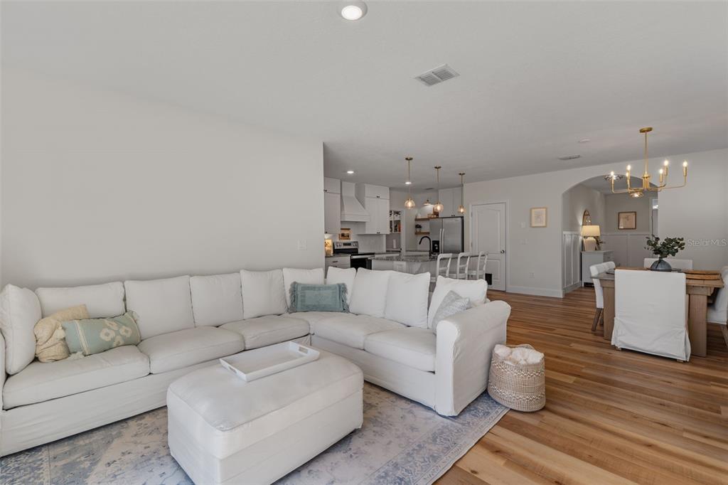 113 Camilla Road DeLand, FL 32724 - Photo 18 of 54 a living room with furniture and kitchen view