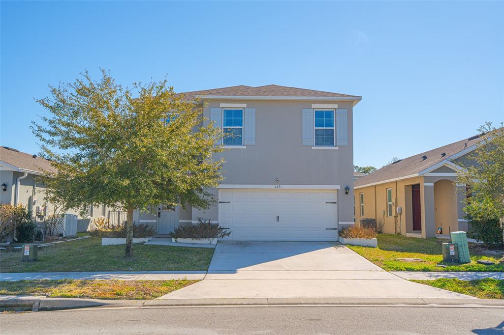 113 Camilla Road DeLand, FL 32724 - Photo 2 of 54 a view of a house with a yard and plants