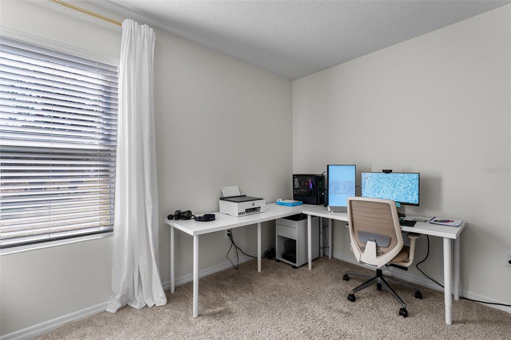 113 Camilla Road DeLand, FL 32724 - Photo 23 of 54 a view of a workspace with furniture and a window