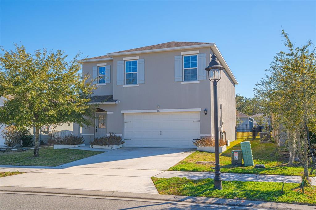 113 Camilla Road DeLand, FL 32724 - Photo 3 of 54 a front view of a house with garden