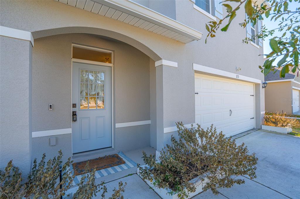 113 Camilla Road DeLand, FL 32724 - Photo 4 of 54 an entryway with wooden floor and a potted plant