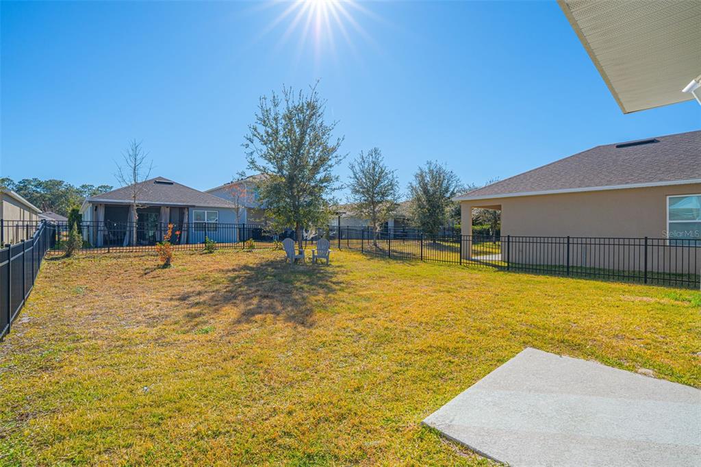113 Camilla Road DeLand, FL 32724 - Photo 47 of 54 a swimming pool with trees in front of it