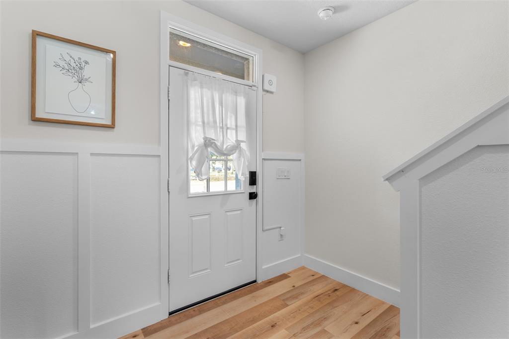 113 Camilla Road DeLand, FL 32724 - Photo 5 of 54 a view of small space with wooden floor and hallway