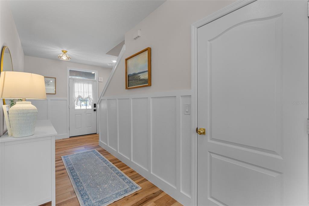 113 Camilla Road DeLand, FL 32724 - Photo 7 of 54 a view of a hallway with wooden floor and a bathroom