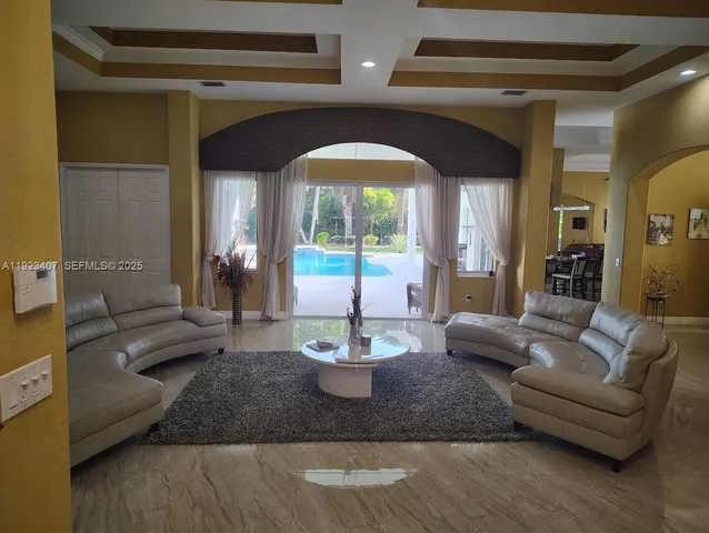 a lobby with furniture and wooden floor