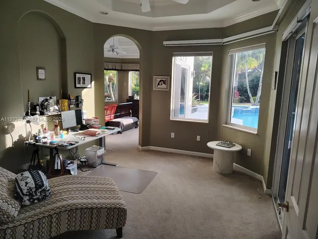 a bathroom with a tub a sink and a large mirror
