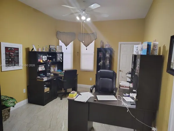 a workspace with furniture and lamp