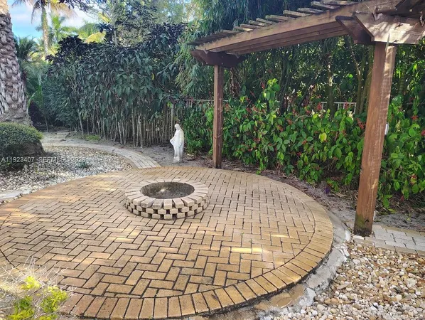a view of backyard with a patio