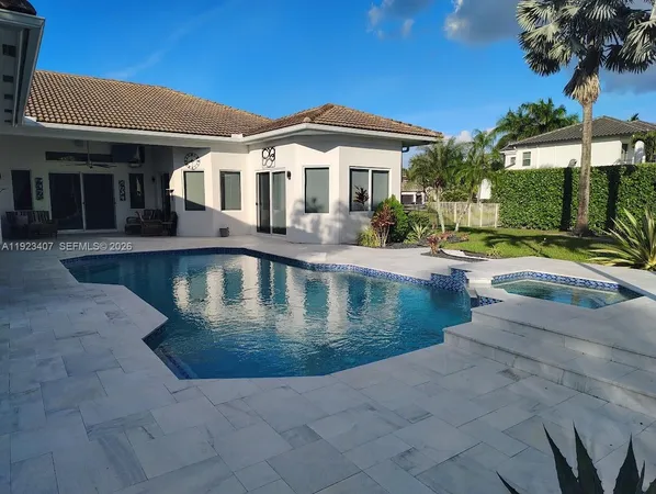a front view of a house with swimming pool
