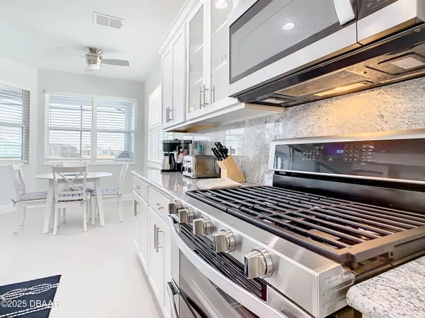 a kitchen with a sink stove and refrigerator