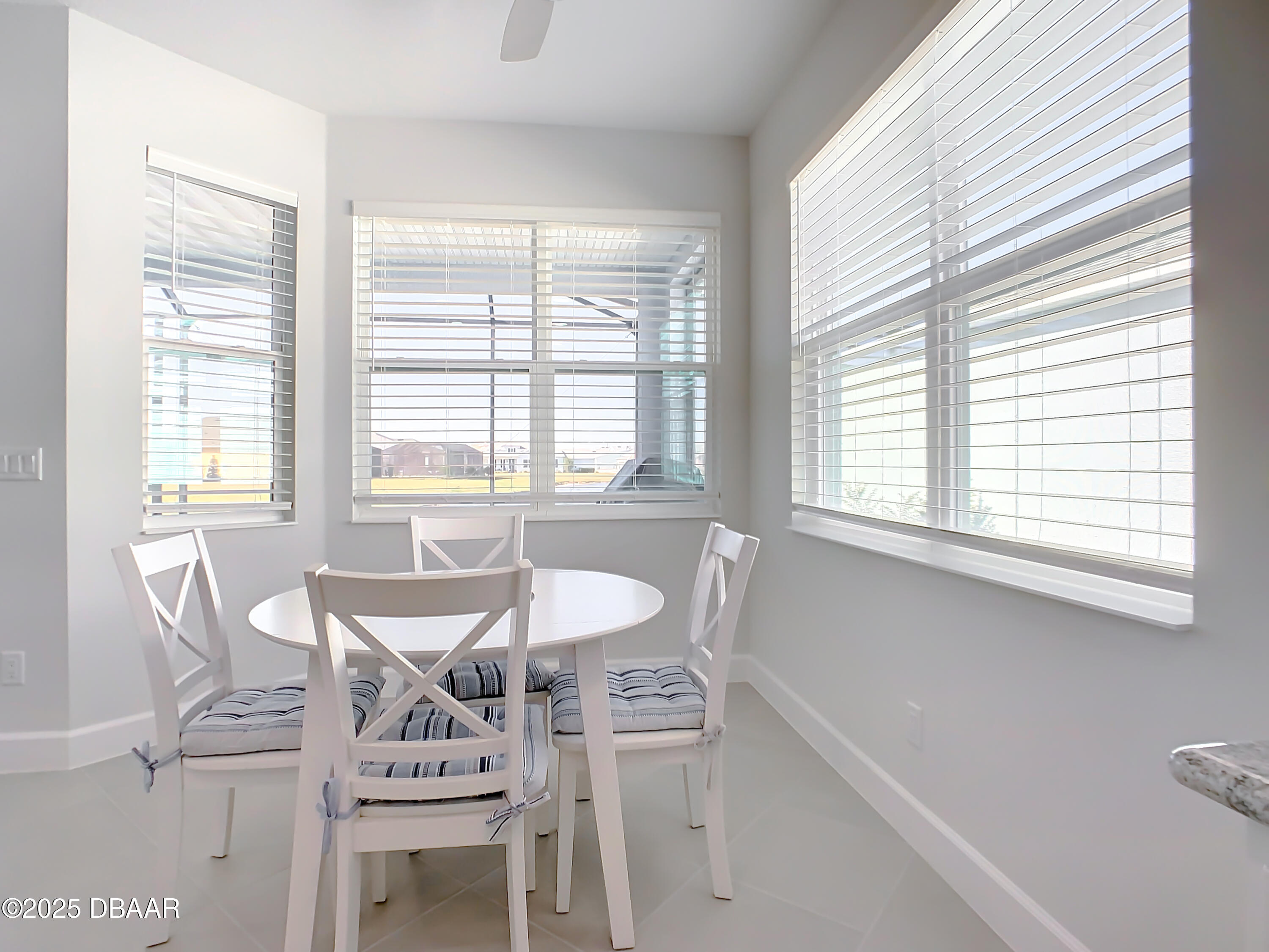 205 Cheeseburger Drive Daytona Beach, FL 32124 - Photo 26 of 79 a dining room with furniture and windows