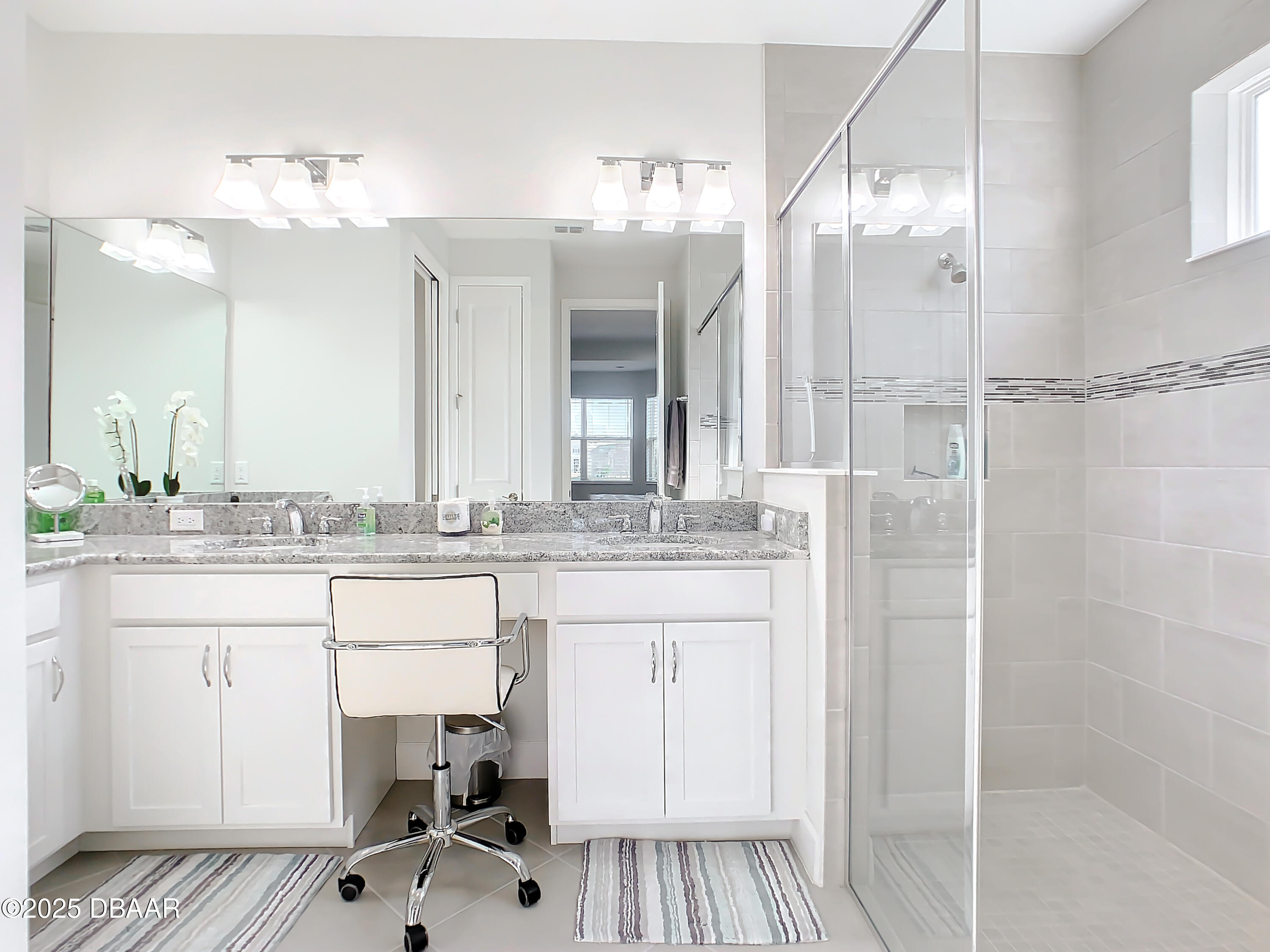 205 Cheeseburger Drive Daytona Beach, FL 32124 - Photo 32 of 79 a bathroom with a sink double vanity and a mirror