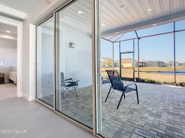 a view of kitchen with furniture and a potted plant