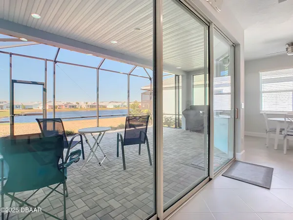 a swimming pool view with a outdoor seating