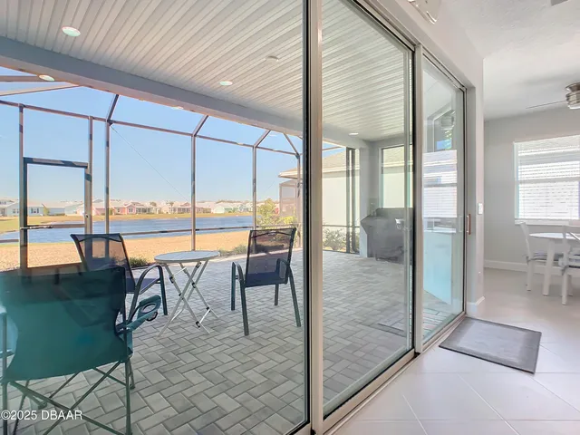 a swimming pool view with a outdoor seating