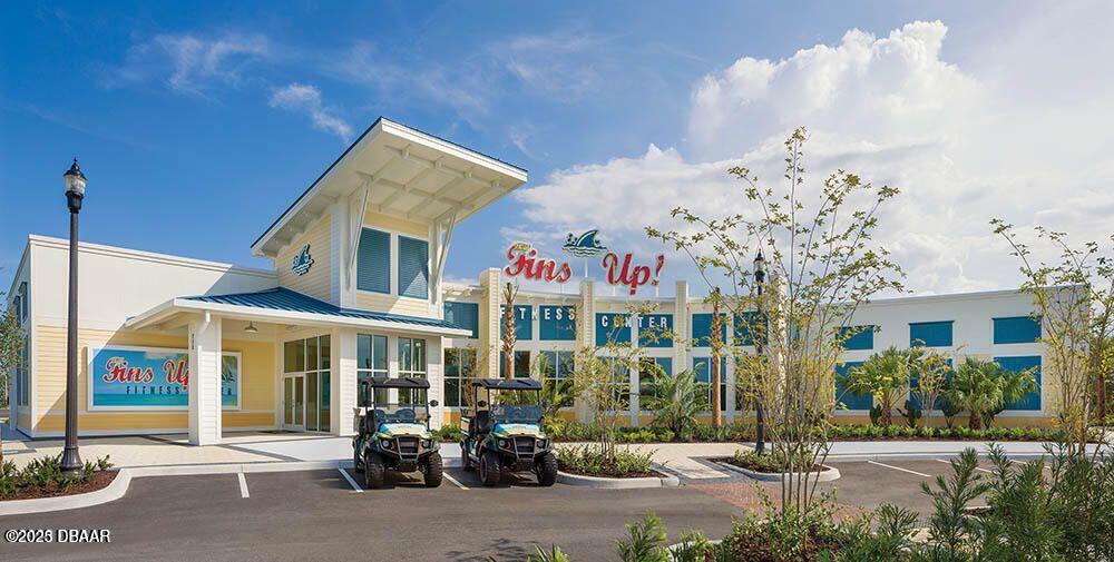 205 Cheeseburger Drive Daytona Beach, FL 32124 - Photo 58 of 79 a front view of a building with retail shops