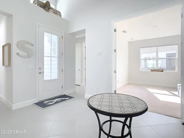 a view of a livingroom with furniture and window