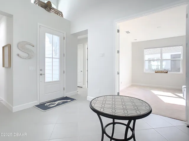 a view of a livingroom with furniture and window