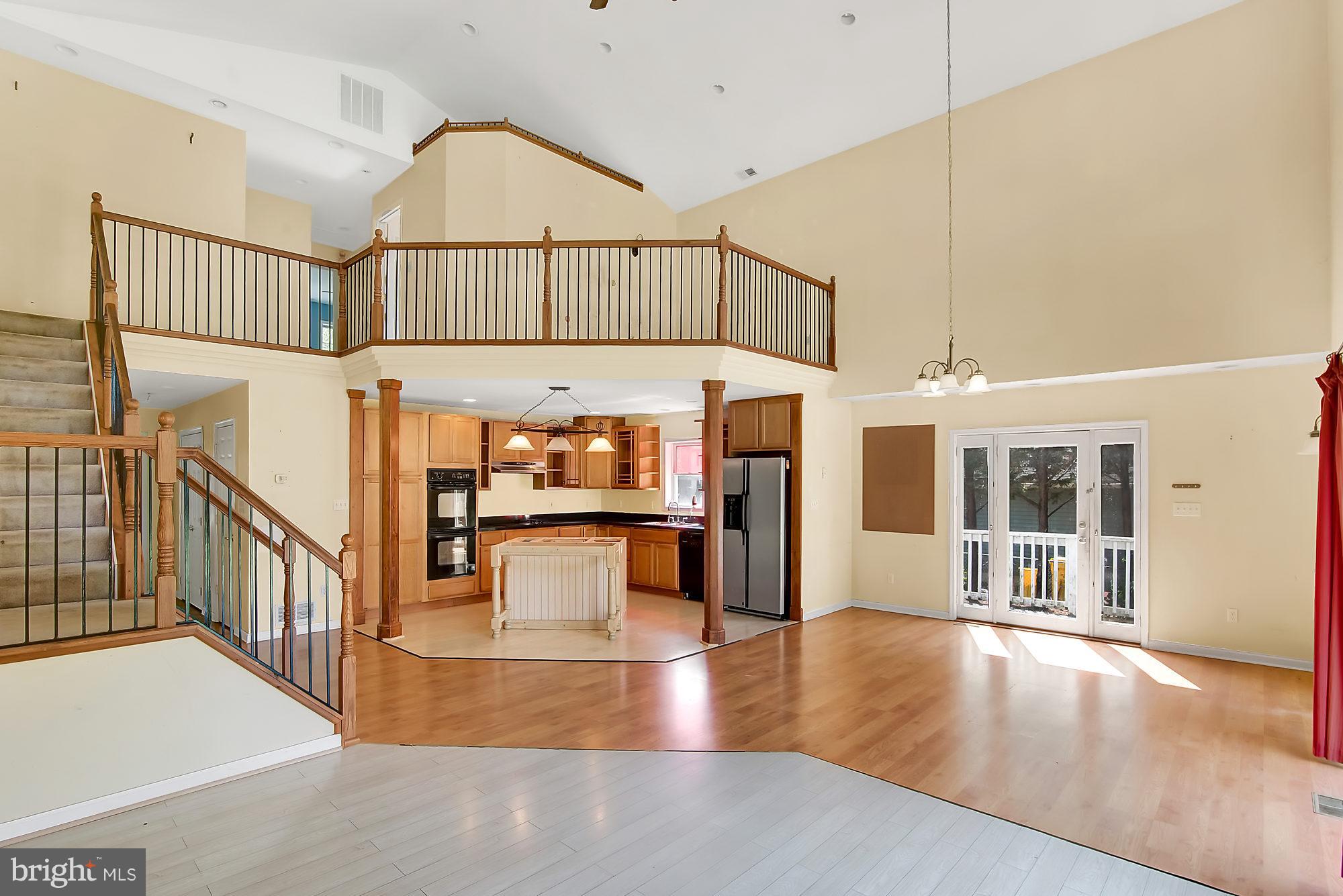 1211 Hillside Road Pasadena, MD 21122 - Photo 6 of 24 a view interior of a house with wooden floor and a large window