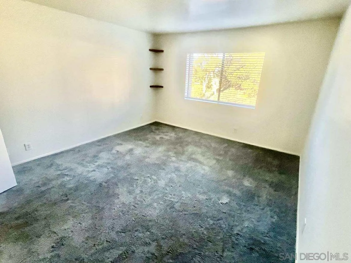3980 Faircross Place, Unit 23 San Diego, CA 92115 - Photo 16 of 21 an empty room with windows