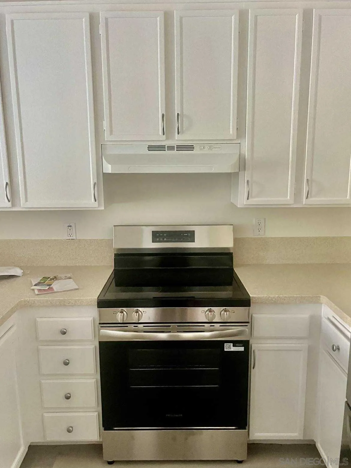 3980 Faircross Place, Unit 23 San Diego, CA 92115 - Photo 5 of 21 a stove top oven sitting inside of a kitchen