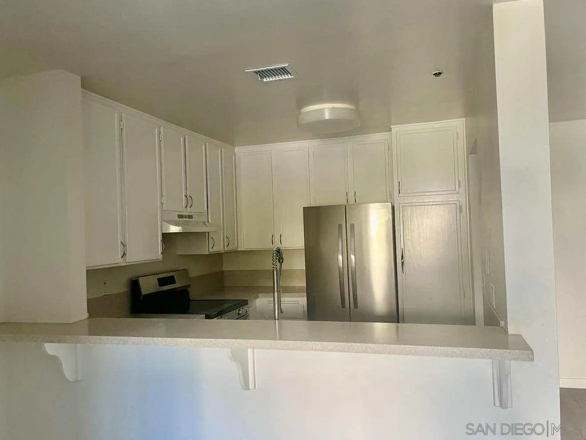 3980 Faircross Place, Unit 23 San Diego, CA 92115 - Photo 6 of 21 a view of kitchen with refrigerator and window