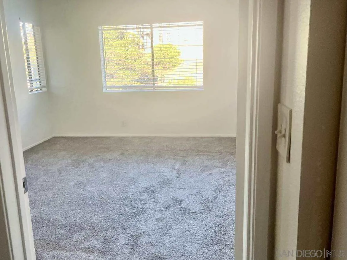 3980 Faircross Place, Unit 23 San Diego, CA 92115 - Photo 8 of 21 a view of an empty room with a window
