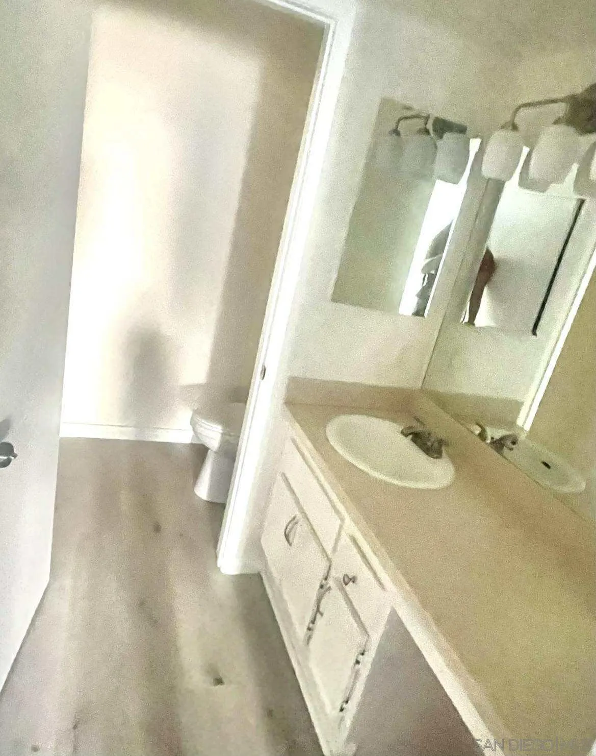 3980 Faircross Place, Unit 23 San Diego, CA 92115 - Photo 9 of 21 a bathroom with a sink a mirror and a shower