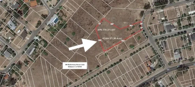 a view of a street with a wall